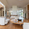 entry hall of a home with white chairs and roundtable