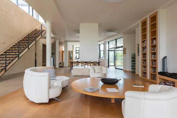 entry hall of a home with white chairs and roundtable